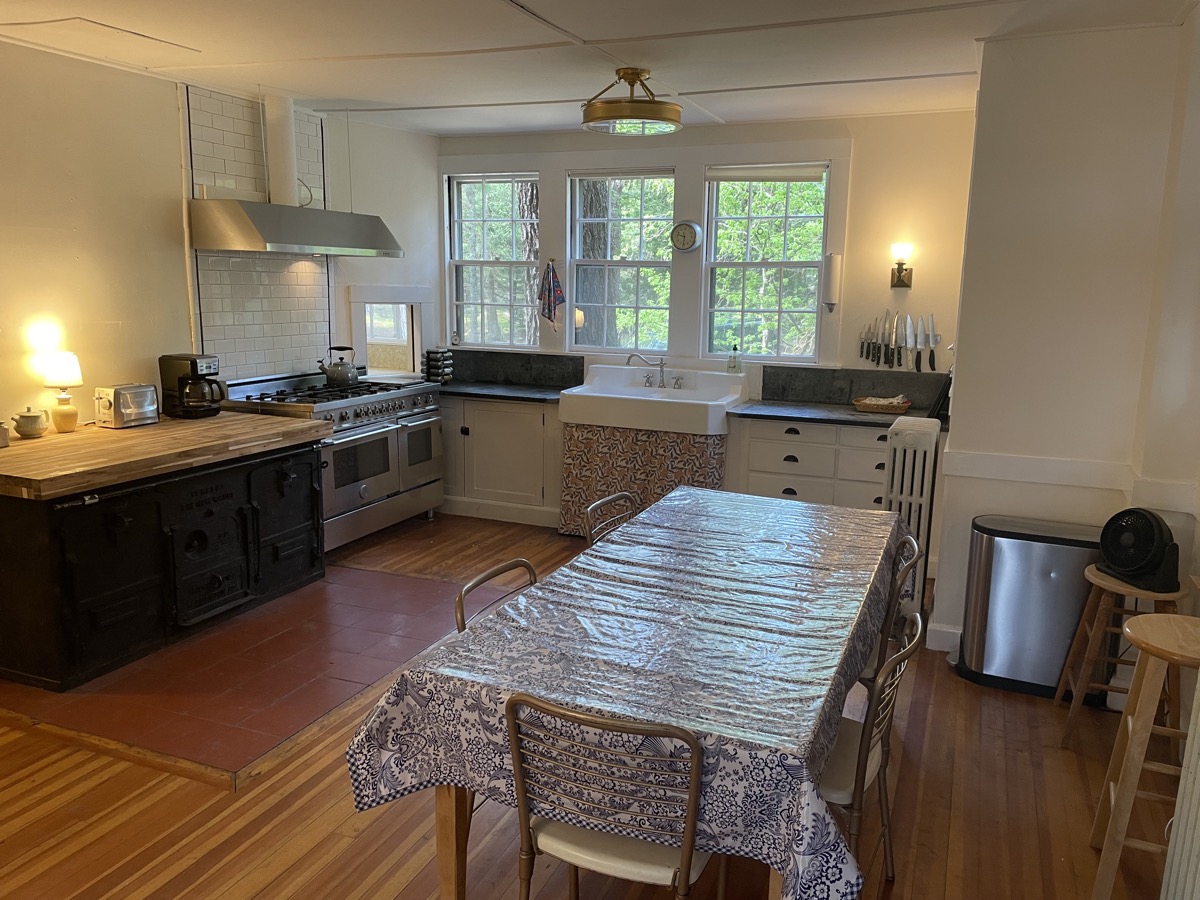 The kitchen with its long counter and butler’s pantry beyond